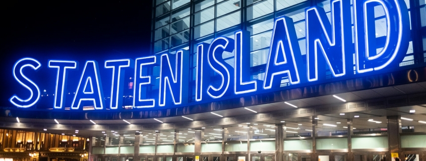 Staten Island Ferry sign, symbolizing the community Troops Relief Fund serves through car donations