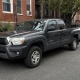 Pickup truck parked on a Brooklyn street near brick residential buildings